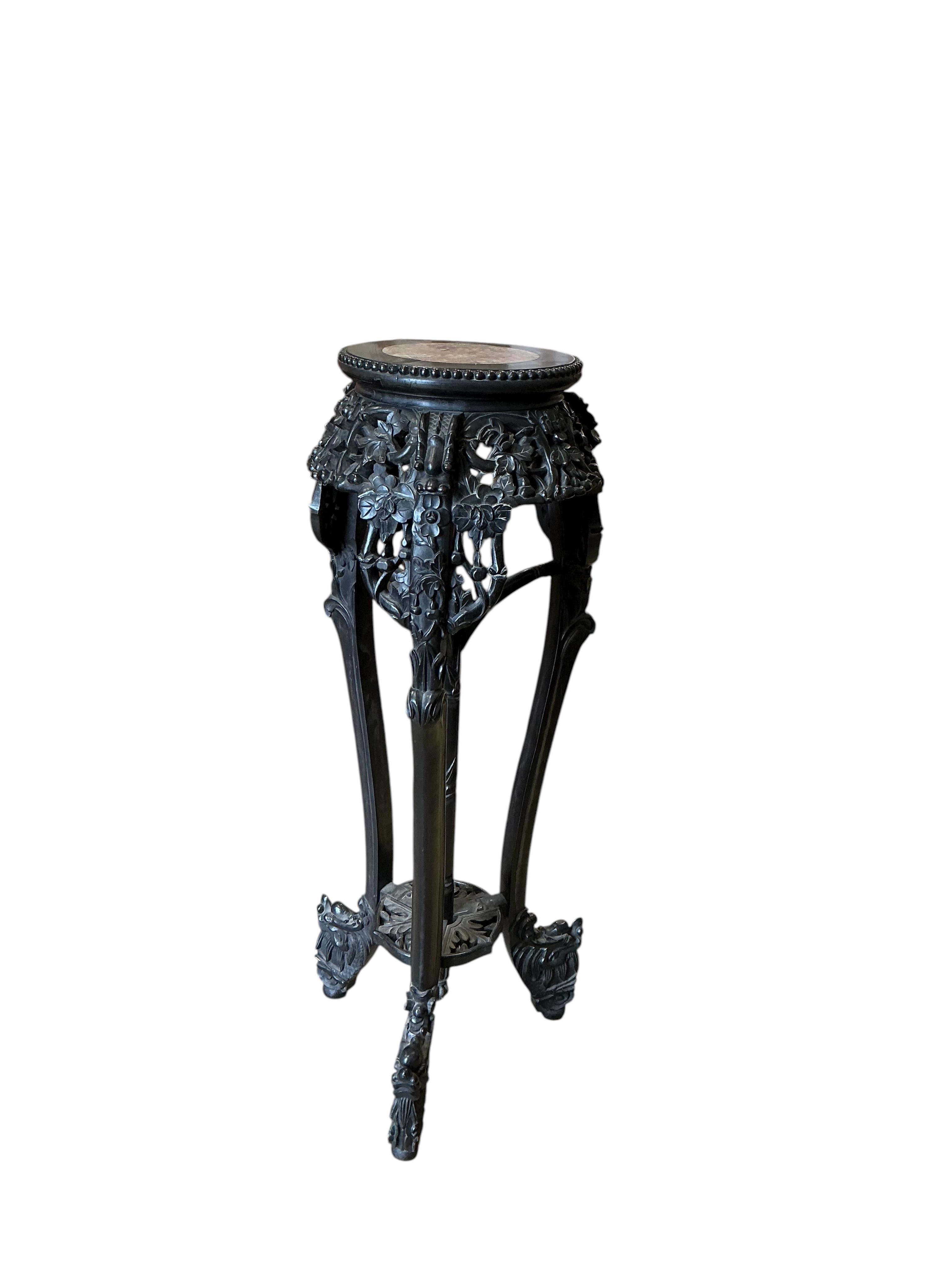 A Chinese marble topped vase stand, diameter 34cm, height 94cm